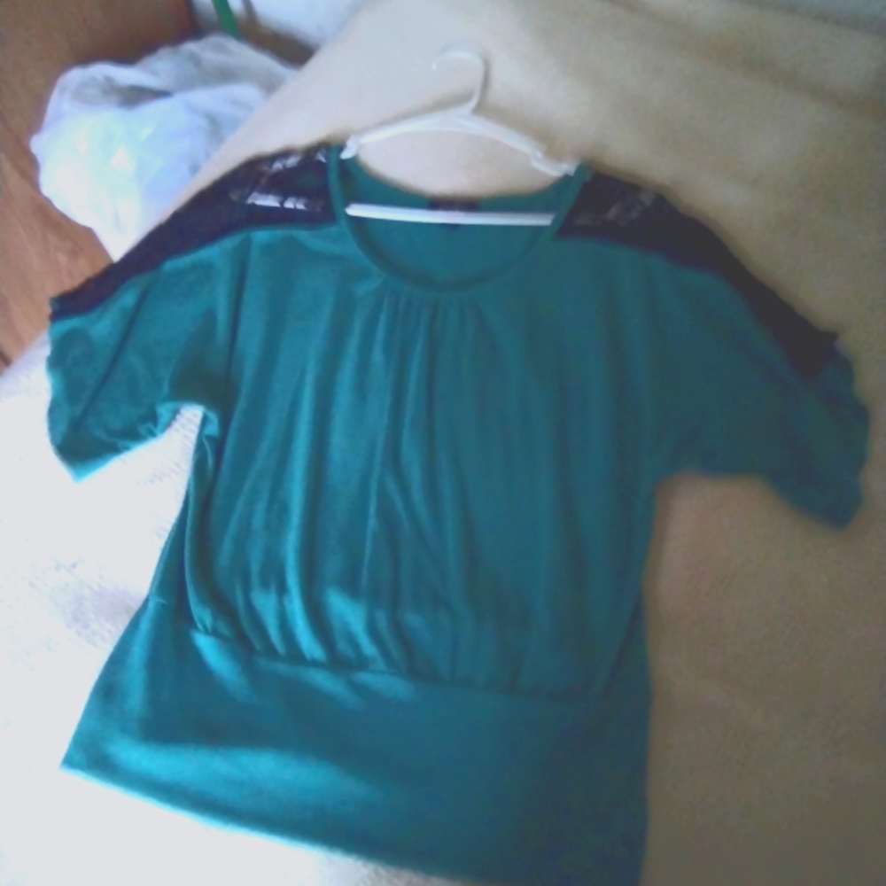 Green top with black lace brand is by by size is large